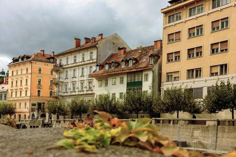 a bunch of buildings that are next to each other, inspired by Thomas Struth, unsplash contest winner, art nouveau, slovenian, beginning of autumn, sunken square, today\'s featured photograph 4k