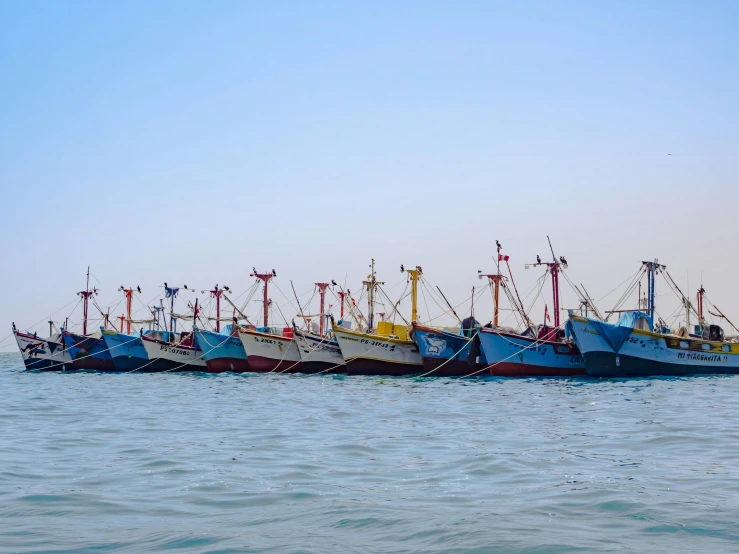 a group of boats sitting on top of a body of water, by Daniel Lieske, pexels contest winner, hurufiyya, fish hooks, profile image, sri lanka, conde nast traveler photo