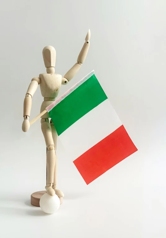 a wooden mannequin holding an italian flag, by Giorgio De Vincenzi, slide show, puppet, medium - shot, f 1