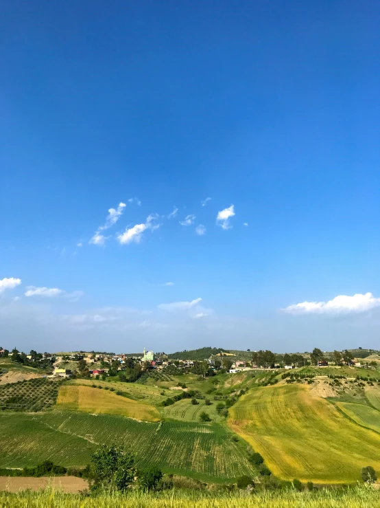 a view of the countryside from the top of a hill, renaissance, clear blue skies, from italica, slide show, background image