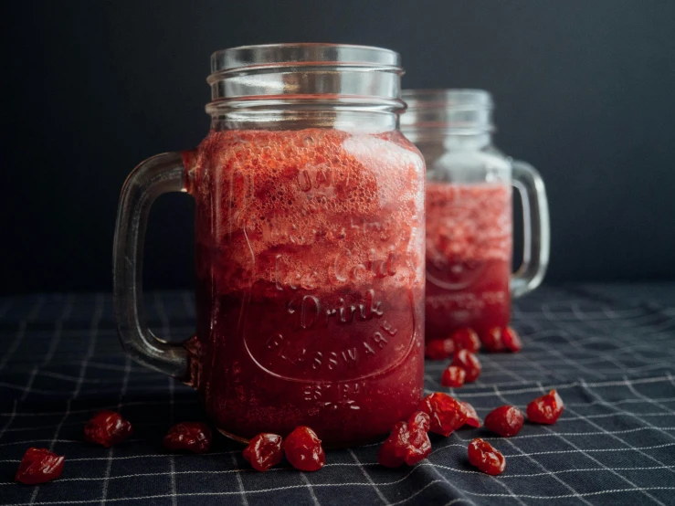 a couple of jars filled with fruit sitting on top of a table, profile image, crimson, slush, lightweight