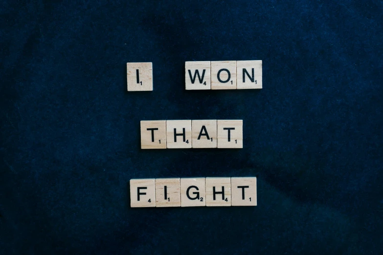 scrabbles spelling i won that flight, pexels contest winner, figurativism, ultimate fighting championship, inspirational quote, unsplash photo contest winner, fight ww 1