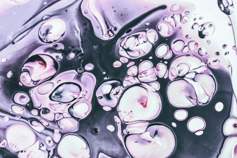 a close up of a mixture of liquid and water, a microscopic photo, inspired by Shōzō Shimamoto, trending on pexels, purple flesh, floating spheres and shapes, on a canva, dewy skin