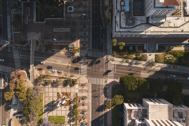 an aerial view of an intersection in a city, unsplash contest winner, photorealism, los angelos, late afternoon sun, square, high quality photo