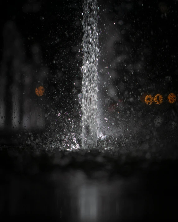 a close up of a water fountain at night, in the rain, profile image, showers, thumbnail