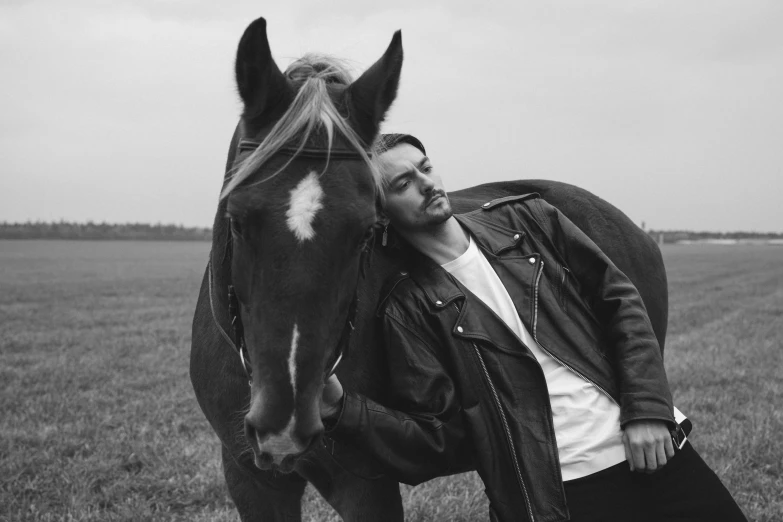 a man standing next to a horse in a field, a black and white photo, by Emma Andijewska, avan jogia angel, mr beast, 15081959 21121991 01012000 4k, liam brazier and nielly