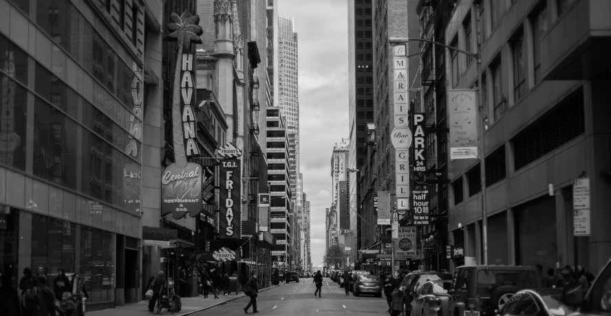 a black and white photo of a busy city street, by Patrick Adam, pexels contest winner, realism, broadway, beautiful day, entertainment district, skyscapers