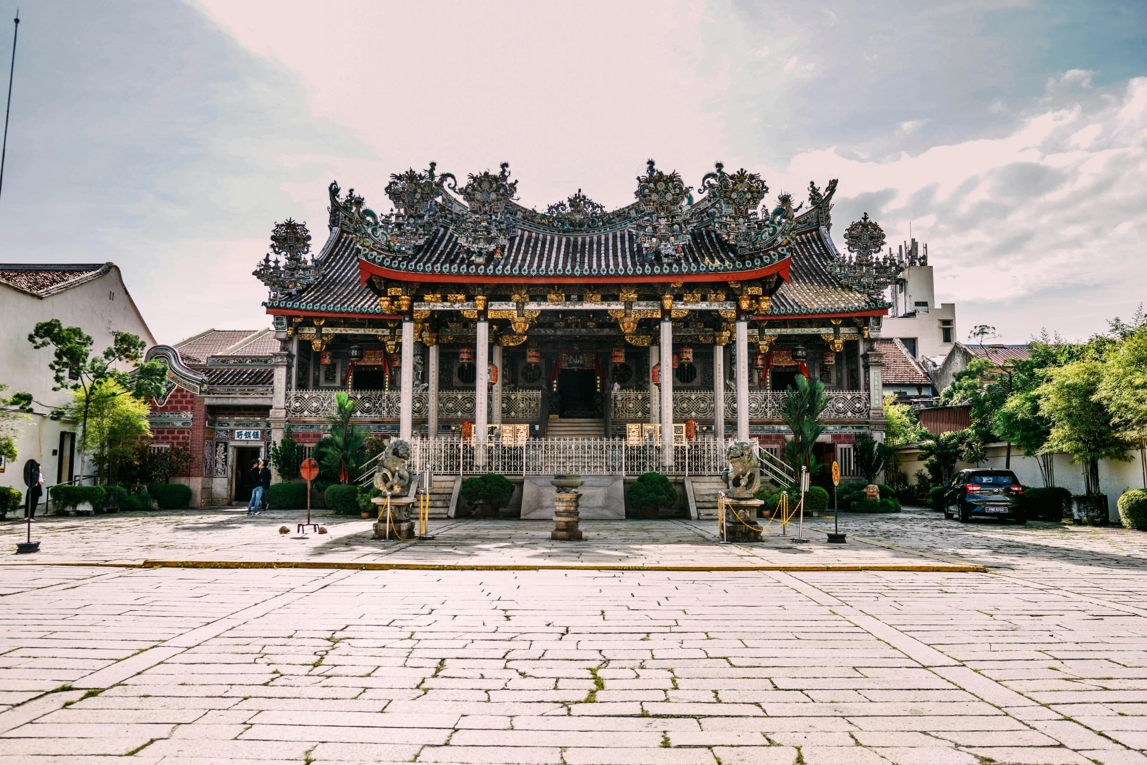 a large building sitting on top of a cobblestone street, by Reuben Tam, pexels contest winner, baroque, chinese temple, taiwan, square, a wide open courtyard in an epic