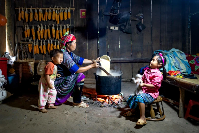 a woman and two children cooking in a kitchen, a portrait, pexels contest winner, longhouse, avatar image, ja mong, woodfired