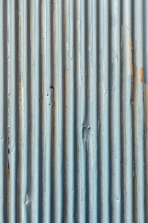 a fire hydrant sitting on the side of a building, an album cover, by David Simpson, unsplash, modernism, iron gate door texture, soft blue texture, striped, oil on aged tin