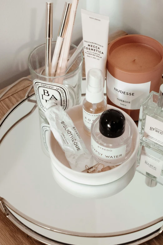 a table with a lot of beauty products on it, by Nina Hamnett, trending on pexels, renaissance, jar on a shelf, pale milky white porcelain skin, label, set on singaporean aesthetic
