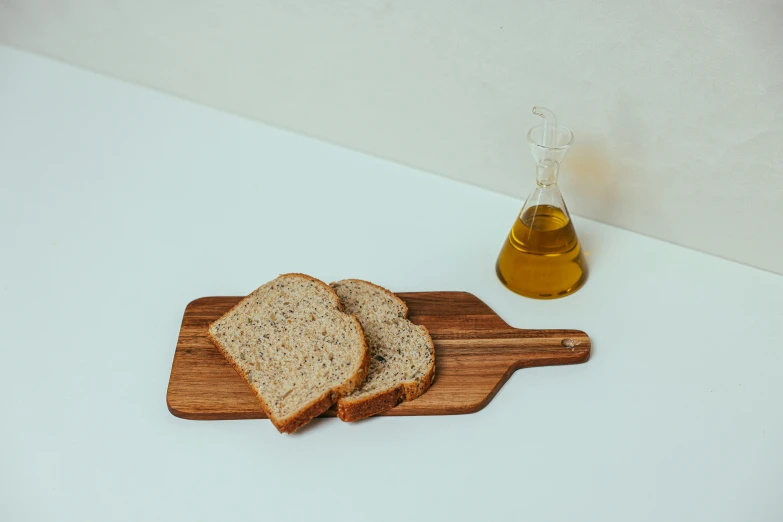 a couple of slices of bread on a cutting board, unsplash, cooking oil, full body image, heavy grain-s 150, 4l