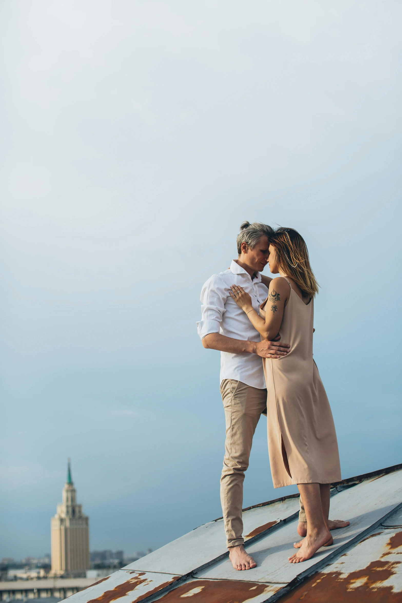 a man and woman standing on top of a roof, cuddling, new orleans, elegant look, instagram picture