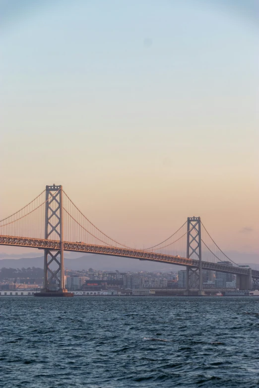 a large bridge over a body of water, a picture, unsplash, renaissance, sf, 2022 photograph, late afternoon, view from the sea