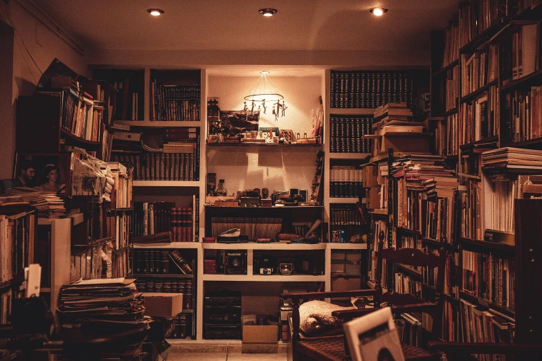 a room filled with lots of books and a clock, unsplash, brown atmospheric lighting, shelves full, family photo, an escape room in a small