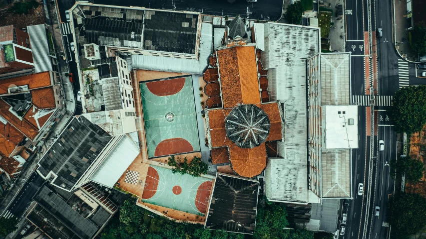 an aerial view of a city with lots of buildings, unsplash contest winner, quito school, basketball court, brutalist courtyard, churches, kacper niepokolczycki