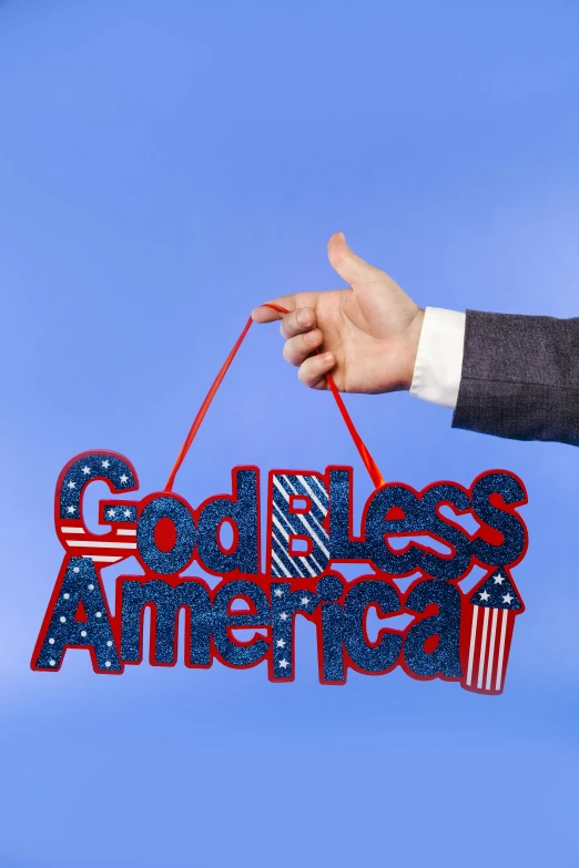 a man holding a sign that says god bless america, an album cover, by Allen Jones, slide show, panel, digital artwork, symbols