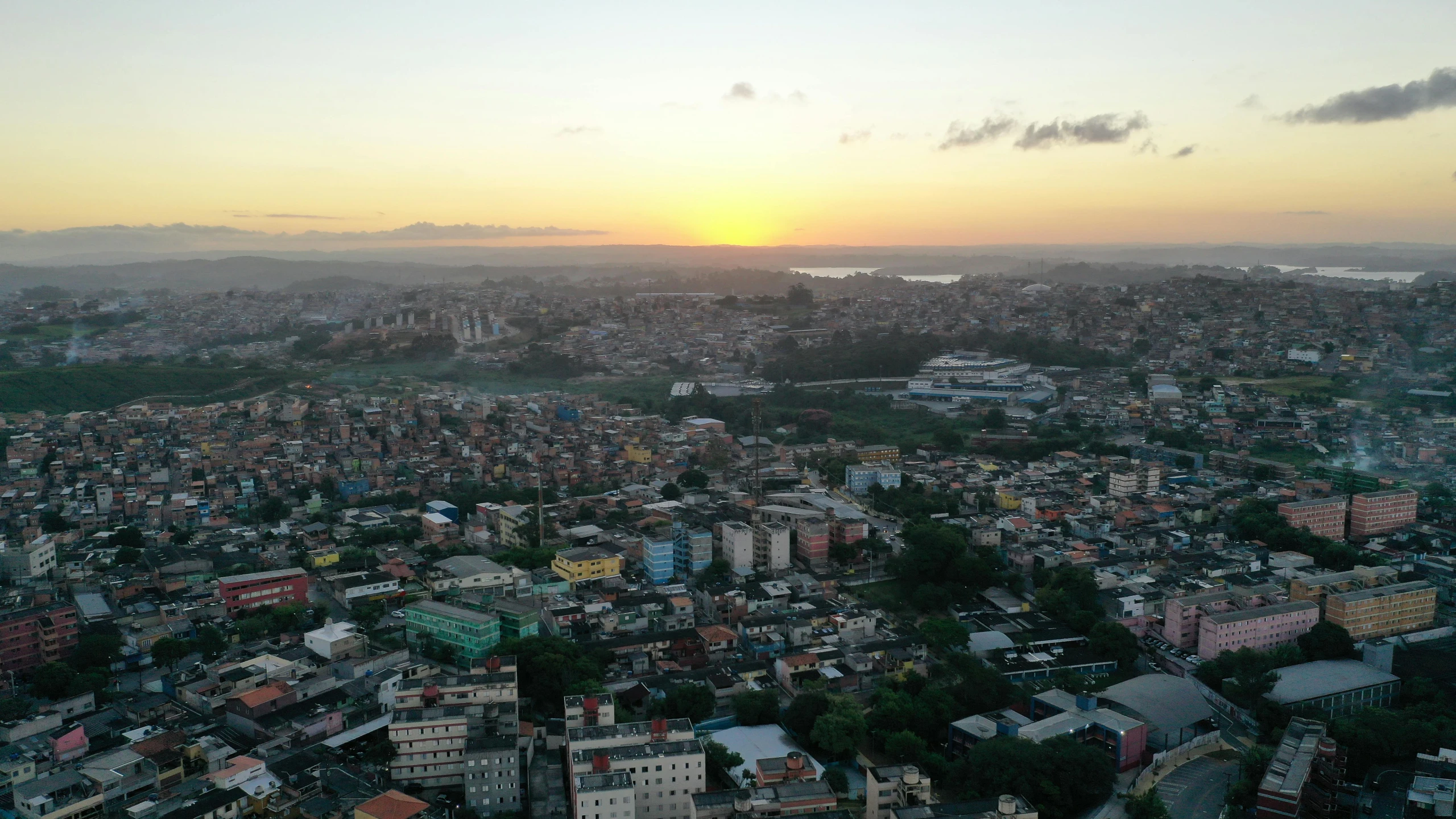 an aerial view of a city at sunset, an album cover, pexels contest winner, brazilian, high quality image, shipibo, poor quality