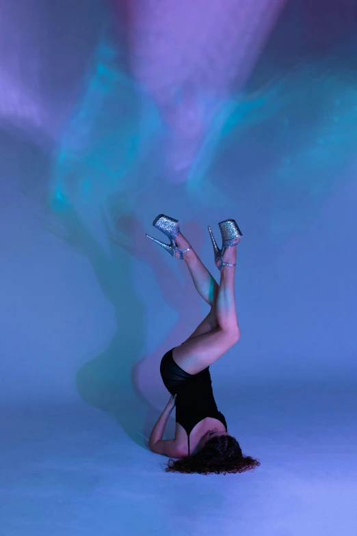 a woman in a black leoper leoper leoper leoper leoper leoper leoper leoper leoper leoper leoper leo, a hologram, inspired by Ren Hang, unsplash, holography, mid view from below her feet, silver and cool colors, doing a backflip, photo from a promo shoot