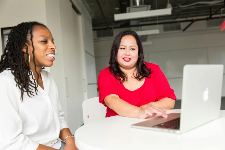 two women sitting at a table with a laptop, unsplash, avatar image