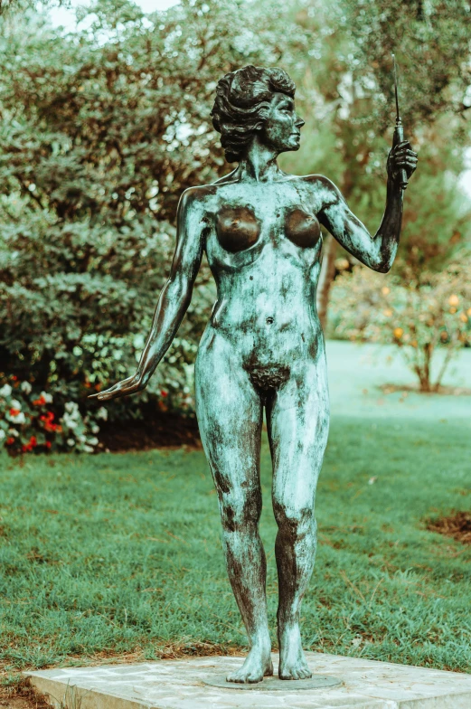 a statue of a woman holding an umbrella, a statue, inspired by Aristide Maillol, pexels contest winner, fine art, in garden, disrobed, spoon slim figure, full frontal shot