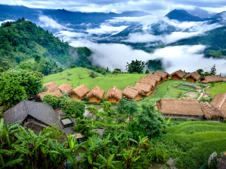 a group of huts sitting on top of a lush green hillside, floating lands in-clouds, fan favorite, villages, list