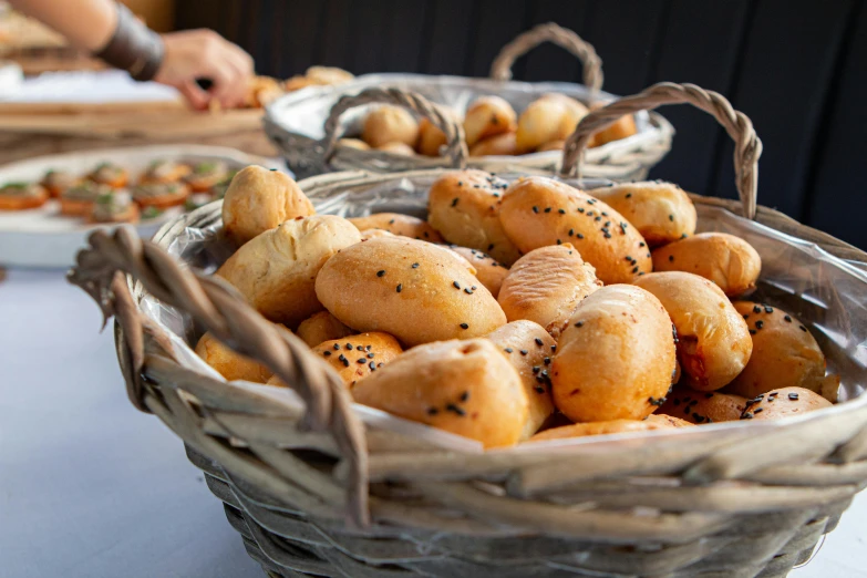 a couple of baskets filled with food on top of a table, crispy buns, up close, high quality product image”, thumbnail