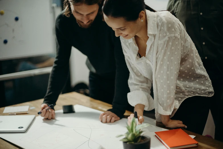 a couple of people that are standing around a table, a drawing, pexels contest winner, cartographic, 9 9 designs, whiteboards, maintenance photo