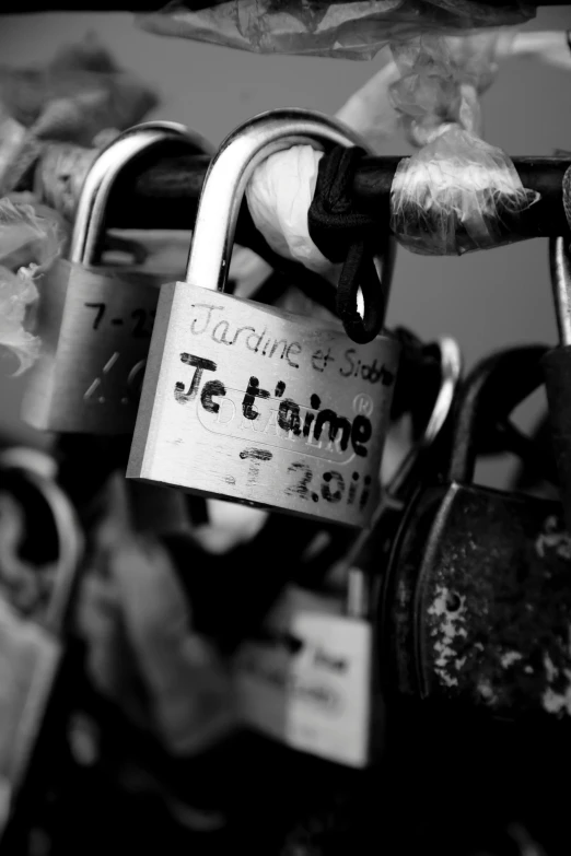 a black and white photo of a bunch of padlocks, by Joseph-Marie Vien, romantic!!!, making out, jaime jasso, a labeled