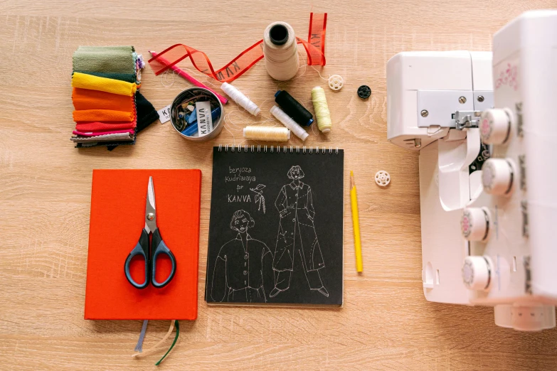 a sewing machine sitting on top of a wooden table, a child's drawing, by Julia Pishtar, pexels contest winner, knolling, schematic in a notebook, artist wearing overalls, costume desig