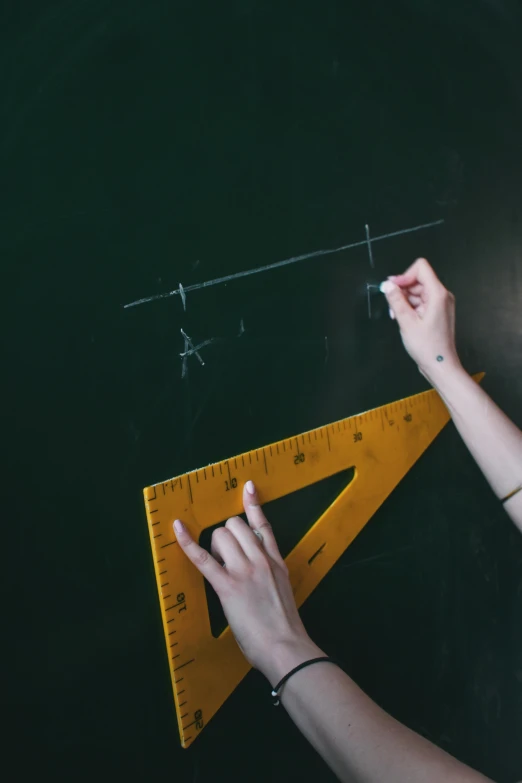 a woman is drawing on a blackboard with a ruler, by Matthias Stom, trending on unsplash, academic art, square lines, angle, hands, 15081959 21121991 01012000 4k