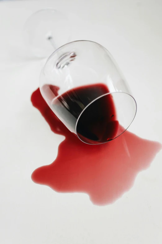 a glass of red wine sitting on top of a table, blood on the floor, profile image, oops, 💣 💥💣 💥