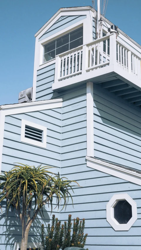 a blue house with a balcony on top of it, white plank siding, promo image, close - up profile, thumbnail