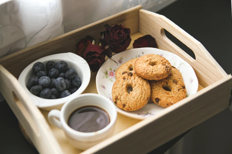 a tray filled with cookies and blueberries next to a cup of coffee, pexels, romanticism, on a wooden tray, listing image, thumbnail, healthy