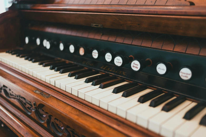 a close up of the keys of a piano, inspired by Bryan Organ, unsplash, vintage electronics, a wooden, inside a grand, lewis carrol