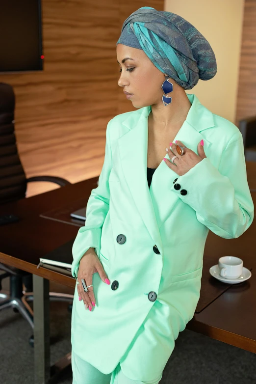 a woman in a green suit and turban smoking a cigarette, trending on pexels, hurufiyya, wearing business casual dress, turqouise, thumbnail, sakimichan