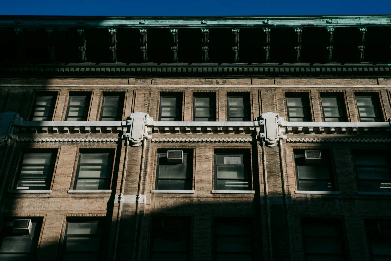 a tall building with a clock on the front of it, pexels contest winner, vancouver school, dappled afternoon sunlight, 1910s architecture, unsplash photography, ignant