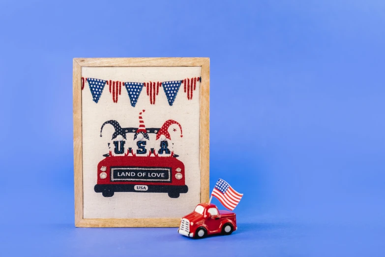 a red truck and an american flag on a blue background, a cross stitch, by Julia Pishtar, official product photo, magic parade float, london bus, set against a white background