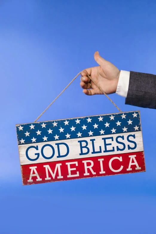 a man in a suit holding a sign that says god bless america, shutterstock, american romanticism, colorful signs, holding a wood piece, with a blue background, slide show