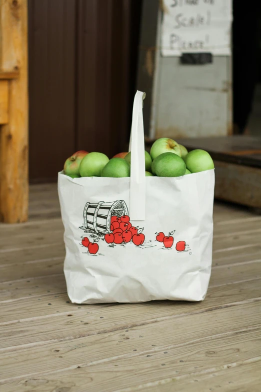 a bag of apples sitting on top of a wooden floor, cart, display item, lined in cotton, cherries