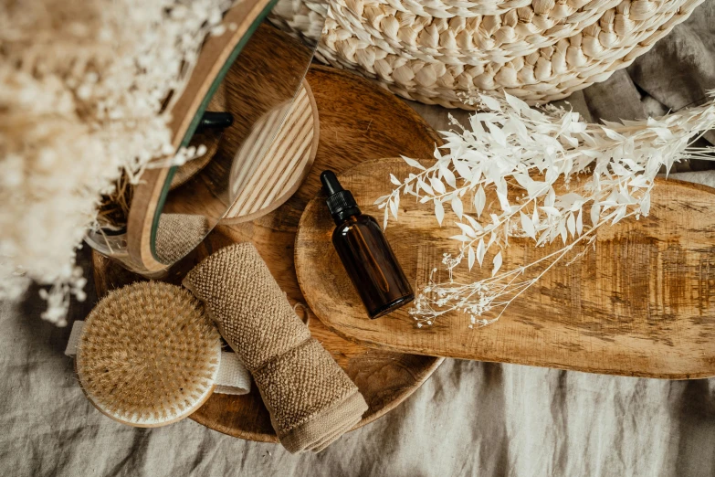 a bunch of items sitting on top of a wooden tray, trending on pexels, arts and crafts movement, skincare, brown, botanical, fan favorite