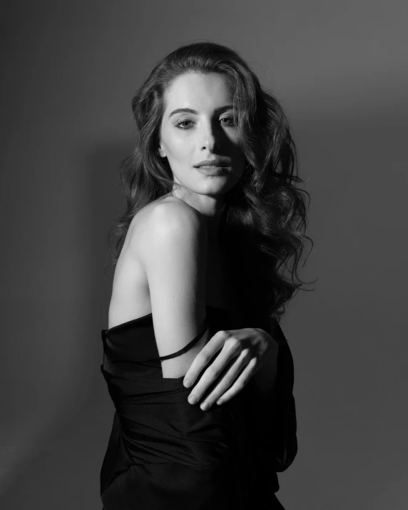 a black and white photo of a woman in a dress, a black and white photo, inspired by Yousuf Karsh, reddit, amber heard, square, anne hathaway, promotional image