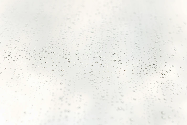 a close up of water droplets on a white surface, pixabay, minimalism, background image, natural window lighting, smooth surface render