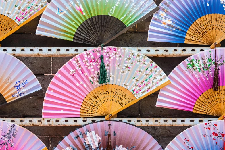 a bunch of colorful fan sitting on top of a shelf, a silk screen, trending on unsplash, ukiyo-e, on a hot australian day, japanese architecture, rectangle, parasols