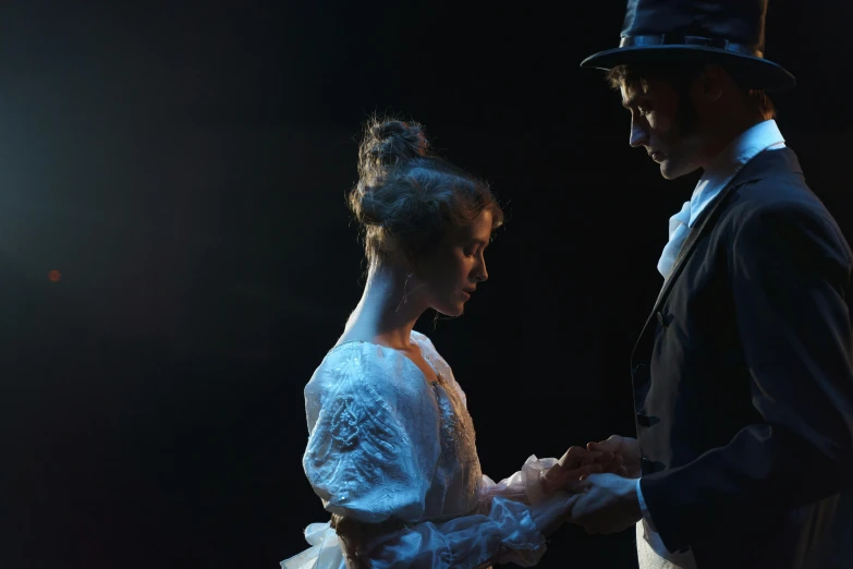 a man and a woman standing next to each other, a portrait, by Alice Mason, unsplash, romanticism, theatrical lighting, wearing victorian clothes, profile image, hands