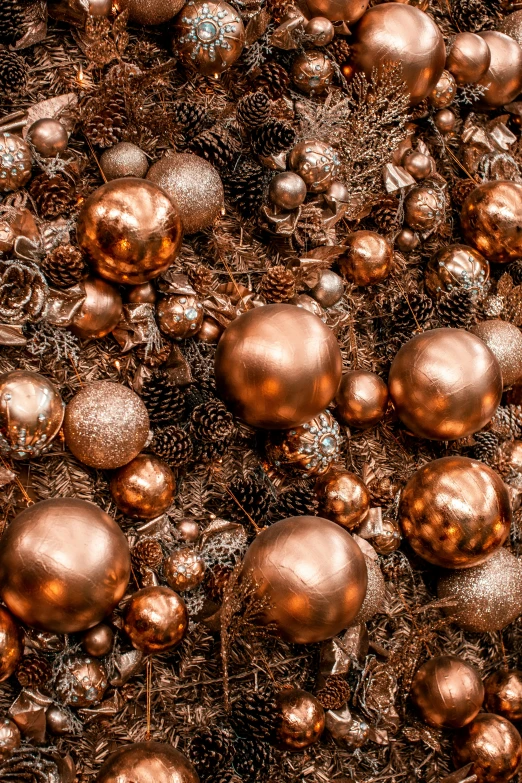 a pile of christmas ornaments sitting on top of a pile of dirt, a digital rendering, trending on unsplash, baroque, intricate copper details, full frame image, brown:-2, spheres