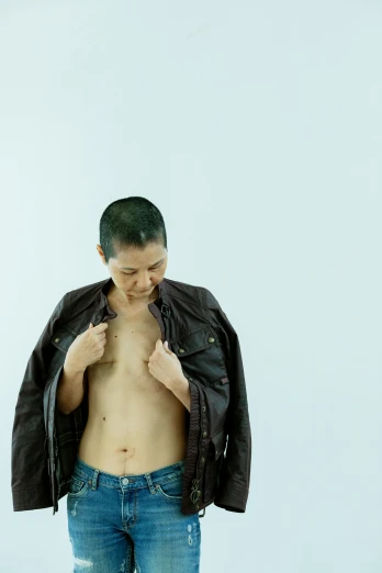 a man in jeans and a leather jacket, an album cover, inspired by Zhang Kechun, unsplash, hyperrealism, small breasts, nonbinary model, marina abramovic, ((tatsuro yamashita))