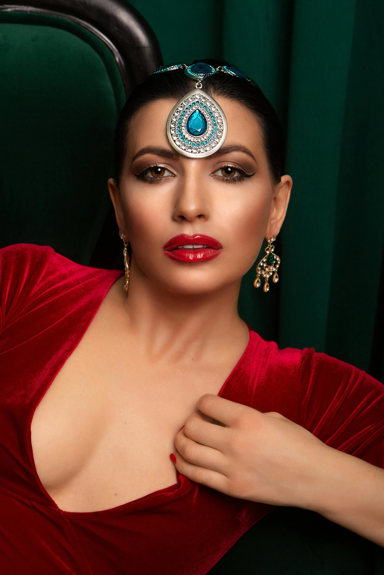 a woman in a red dress posing for a picture, blue jewellery, promotional image, glam photo, provocative indian