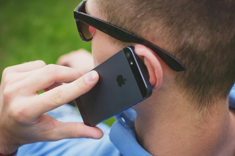 a man in sunglasses talking on a cell phone, pexels, gauged ears, square, facepalm, minor blur