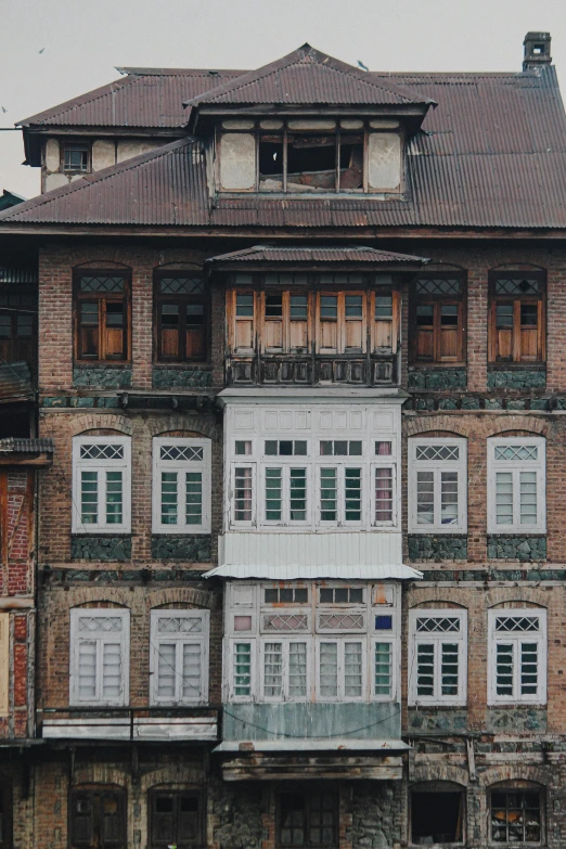 a couple of people that are standing in front of a building, inspired by Matthias Jung, pexels contest winner, art nouveau, bhutan, panoramic shot, guwahati, victorian house